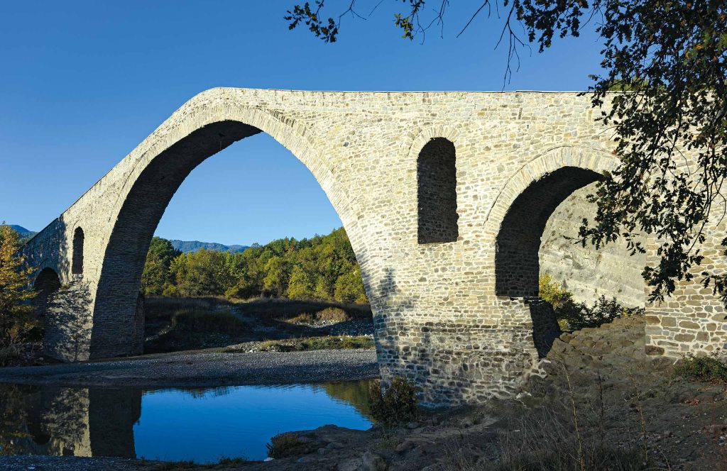 The traditional stone Bridge of Aziz Aga, over the Venetikos river, Grevena.